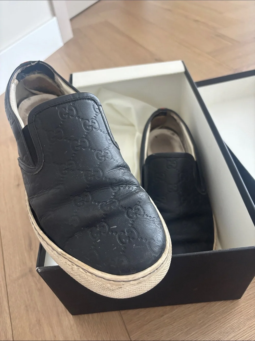 Gucci Black Embossed GG Leather Slip-On Sneakers